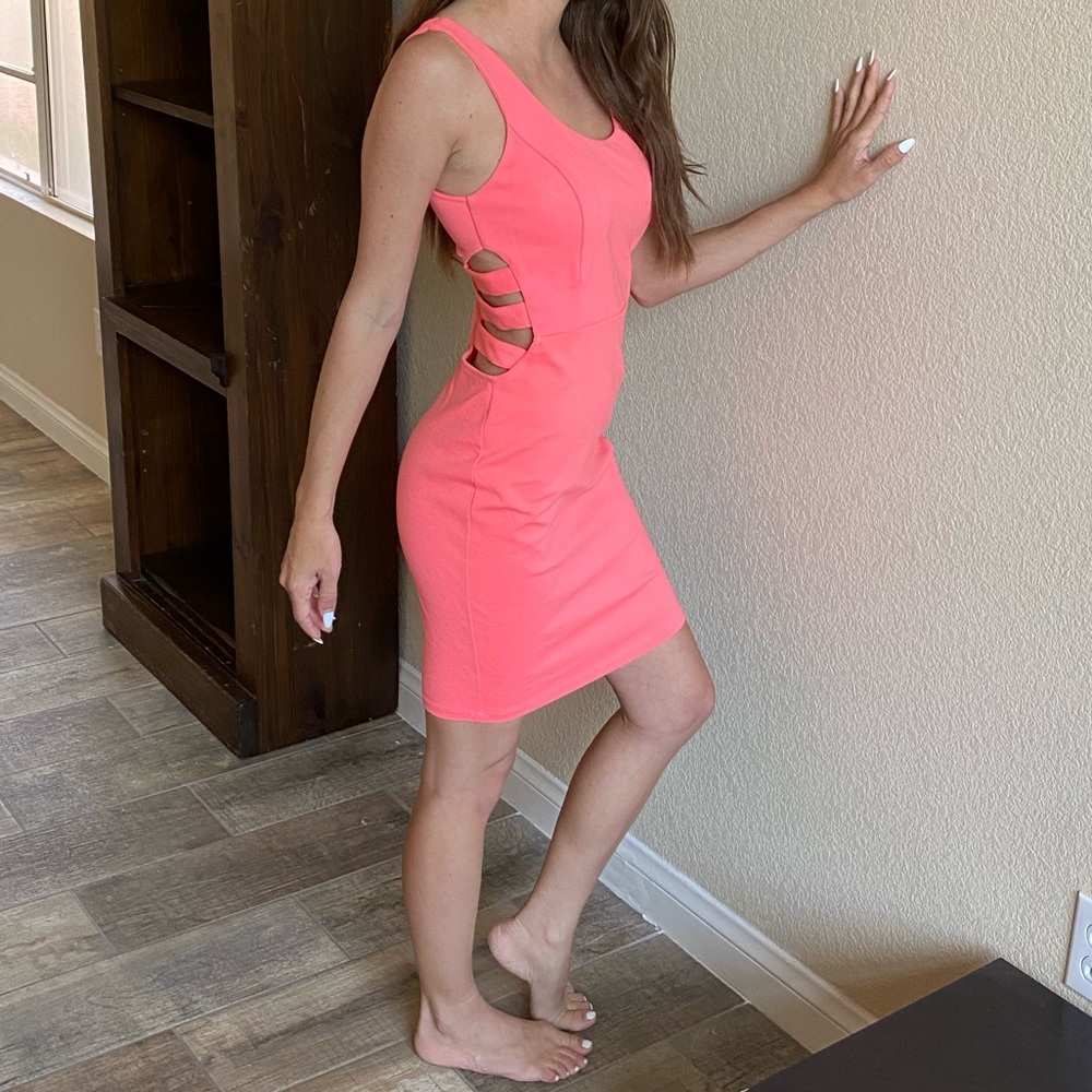 Coral pink cocktail dress with side cutouts